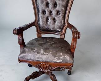 Victorian Revival–style carved wooden armchair