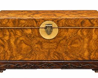 burl-wood storage chest with Asian-inspired brass hardware and a carved wooden base 