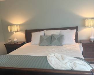 King-size cherrywood sleigh bed, two bedside tables, low dresser.