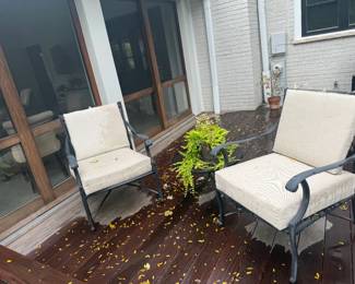 Two patio lounge chairs, black aluminum, with outdoor cushions