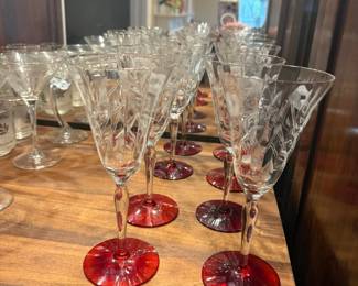 Picture 1 Vintage colllecgtion of mid-century crystal stemware featuring hand-etched floral and ruby-red bases. Vintage colllecgtion of mid-century crystal stemware featuring hand-etched floral and ruby-red bases.