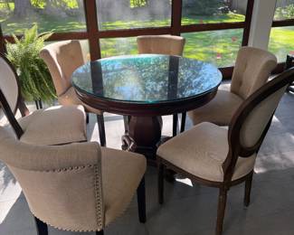 Four upholstered dining chairs with brass tacks