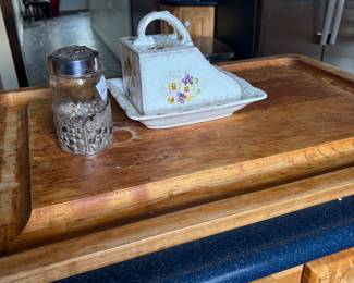 Covered butter dish and canister on butcher-block counter