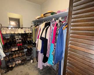 Walk-in closet with shoe rack, hats and women's clothing