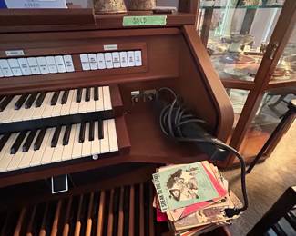 Organ keyboard and bass pedals with sheet music