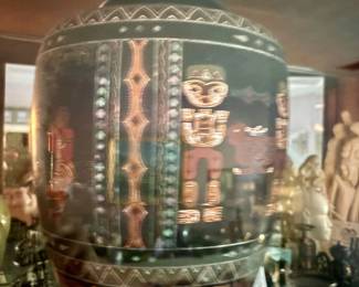 Black etched vase with geometric tribal-style figures in curio