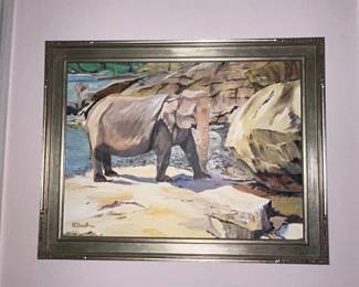 Framed painting of elephant at rocky shoreline