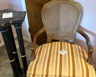 Cane-back striped armchair with black pedestal stand