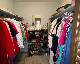 Walk-in closet with tops, dresses, shoes and hats