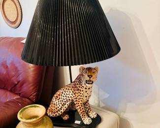 Ceramic leopard figural table lamp with black pleated shade