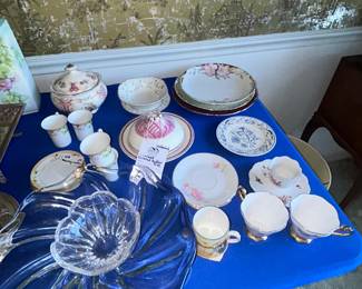 Floral teacups, saucers and plates with crystal bowl
