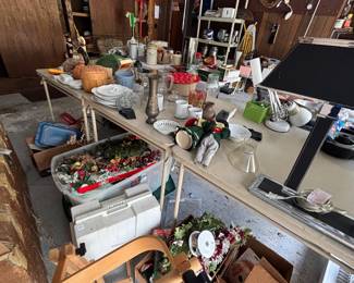 Garage worktable with tools, bench and household goods