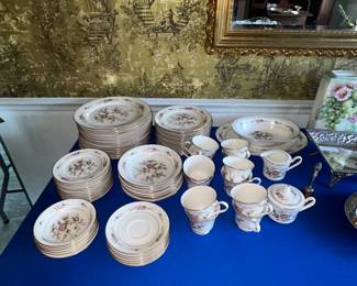Floral transfer-style dinnerware set with cups and saucers