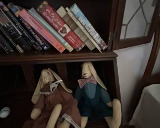 Secretary bookcase shelves with books and bunny dolls