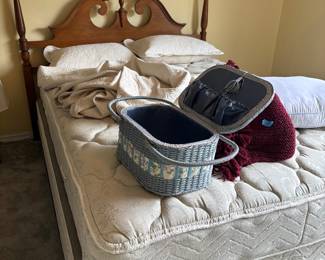 Wood pineapple-finial bed with baskets and textiles