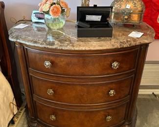 Marble-top bowfront nightstand with jewelry box and brass box