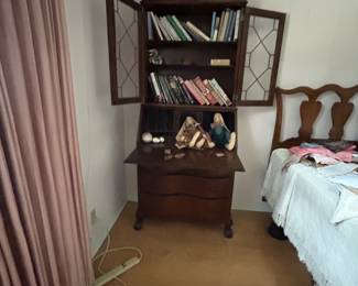 Mahogany-finish secretary bookcase with books and twin bed