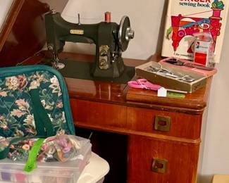 White Sewing Machine in Cabinet