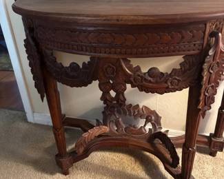 Ornately Carved Wood Demilune Console Table with Floral Garland  Scrollwork Details