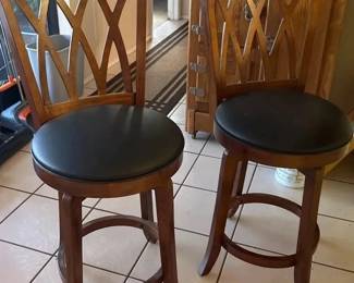 Pair of Wood Swivel Bar Stools with Geometric Lattice Backs  Black Cushioned Seats
