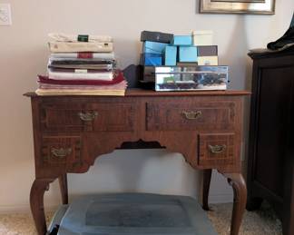 Dressing table or vanity, would make a nice piece for an entryway! Maybe it would be harder to lose your keys?