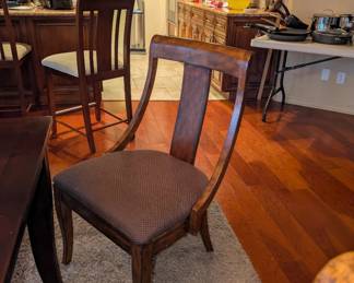 One of the six dining table chairs
