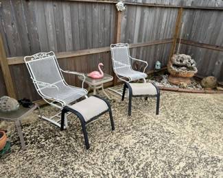 Poolside white white iron chairs and yard art