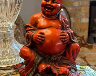 Red Resin Laughing Buddha riding a Tortoise
