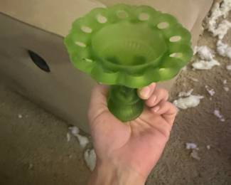 A beautiful, collectible vintage green satin/matte finish glass compote candy dish. Features a classic footed pedestal base and a decorative open-work open-ring rim border design. Vibrant green colorway that adds a beautiful pop to any antique glass display collection.
