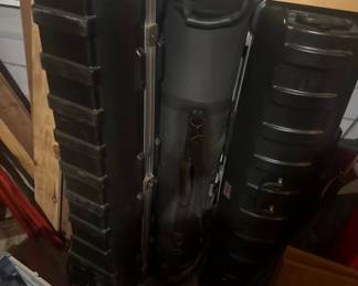 Heavy-duty, industrial-grade protective travel cases. Includes two rugged, ribbed black hard-shell transport flight cases with secure metal latches—ideal for trade shows, golf clubs, musical instruments, or sensitive electronics. Also comes with a premium padded soft/hard hybrid central gear bag with heavy-duty handles