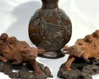 Cast metal vase and carved wood water buffalo