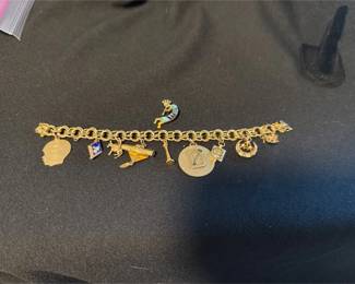 14 Karat Gold Charm Bracelet with Several Charms Also Marked 14 Karat