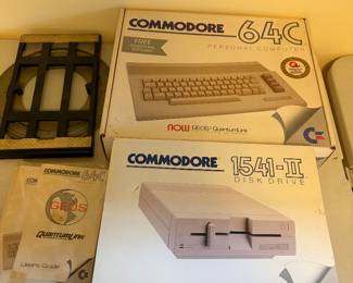 New in Box Commodore 64 1541-II personal computer, disk drive, manuals, software and swivel -only lacks a monitor. Never used, still wrapped in factory plastic