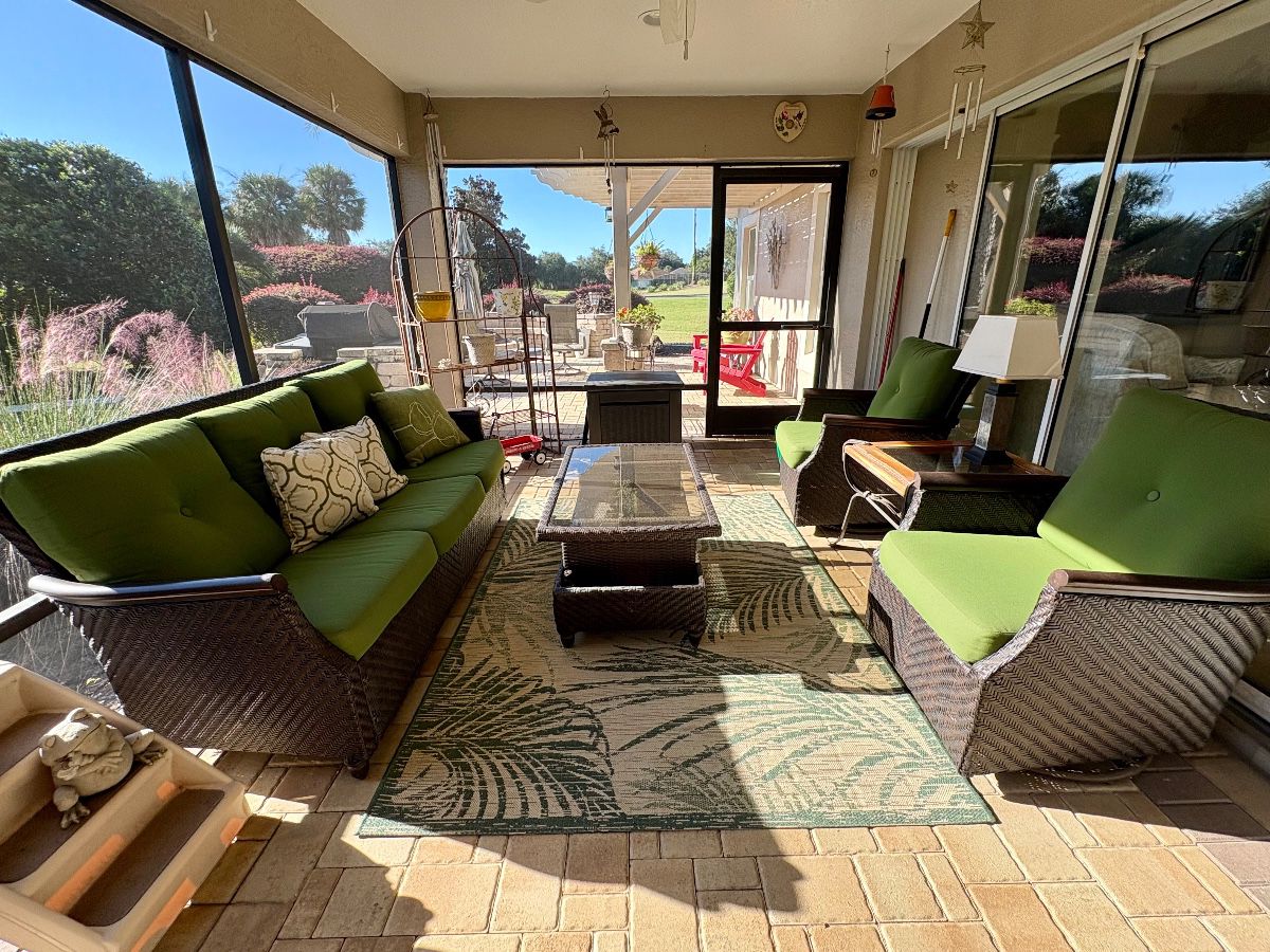 4-piece resin wicker outdoor patio set. Set includes a sofa, coffee table and two swivel gliders. 