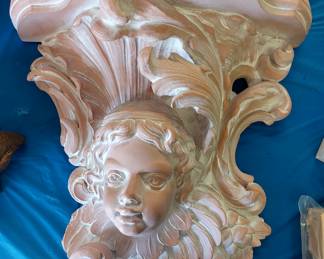 Terra cotta angel shelf