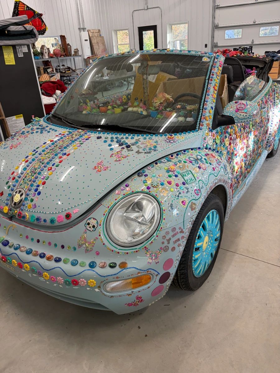 Volkswagen New Beetle convertible, custom decorated with gems. One of a kind. Details coming soon.