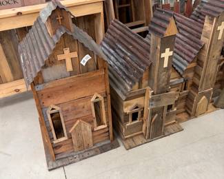 Handmade rustic church birdhouses with tin roofs.