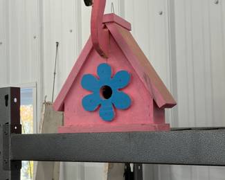 Handmade rustic wood birdhouse.