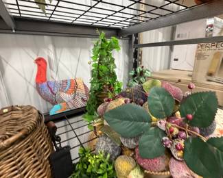 Easter and spring decor: ceramic chicks and ducks, baskets, and faux florals.