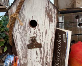 Handmade rustic wood birdhouse.