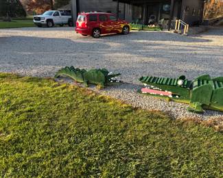Giant handmade wooden yard crocs with painted teeth and eyes. One of a kind yard art.