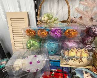 Easter and spring decor: ceramic chicks and ducks, baskets, and faux florals.