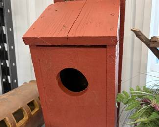 Handmade rustic wood birdhouse.