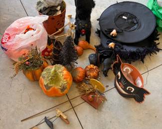 Halloween decor: witch hats, pumpkins, black cats, skulls, and more.