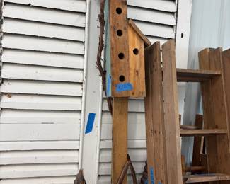Tall rustic birdhouses.
