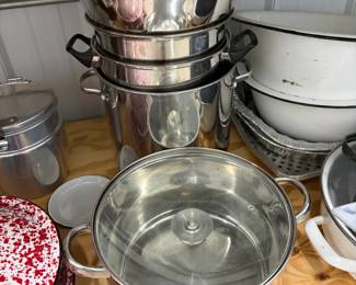 Stainless steel pots and colanders.