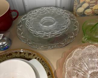 Glass cake stand and serving pieces.