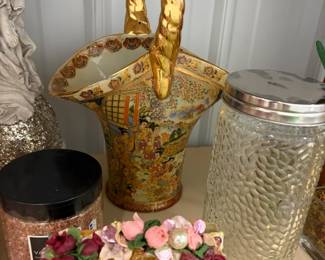Gold basket and glass canister.