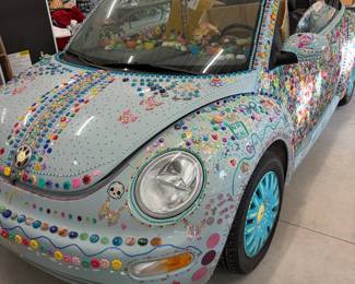 Volkswagen New Beetle convertible, custom decorated with gems. One of a kind. Details coming soon.