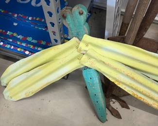 Metal dragonfly yard art.